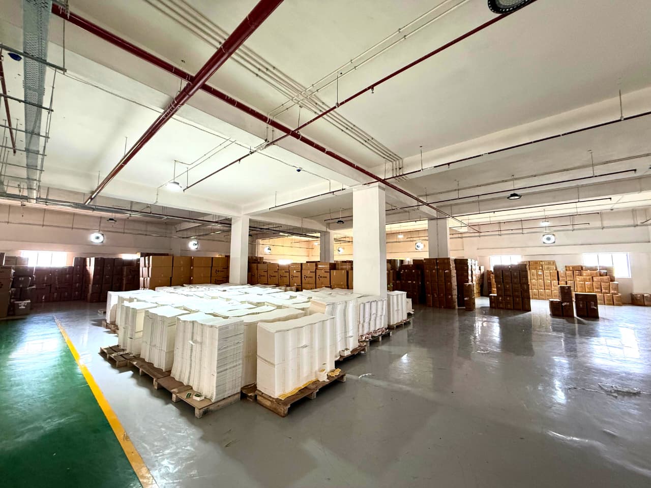 Warehouse stocked with palletised inventory, built for scale